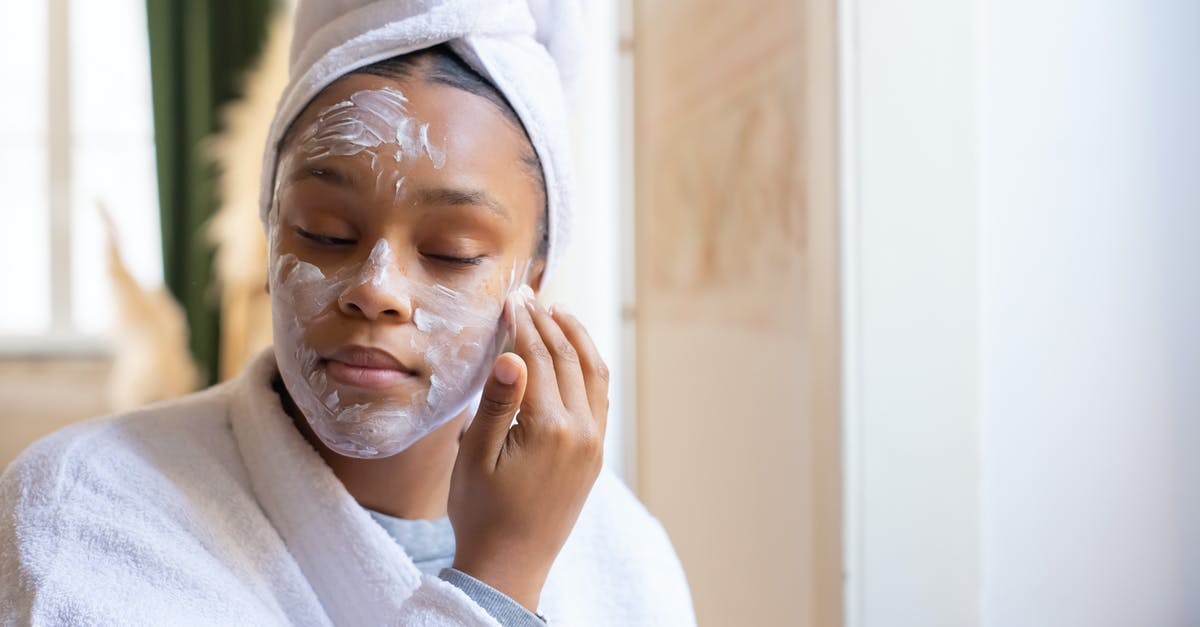 Applying for 2 UK visas simultaneously [closed] - Girl Applying Cream on Her Face