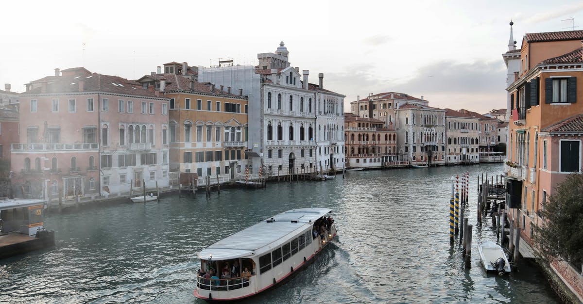 Applying for a Schengen visa early because of another trip - Venice waterway with old buildings and ferry Applying for a Schengen visa early because of another trip - Venice waterway with old buildings and ferry
