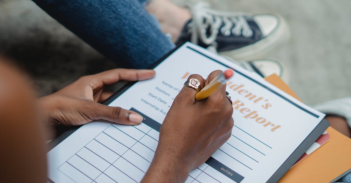 Applying for a Schengen visa with a valid US student visa and an expired I-20 form - Crop student writing report with pencil Applying for a Schengen visa with a valid US student visa and an expired I-20 form - Crop student writing report with pencil