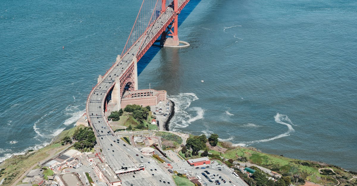 Applying for a USA B-2 visa because of travel history - Contemporary suspension bridge above blue bay Applying for a USA B-2 visa because of travel history - Contemporary suspension bridge above blue bay
