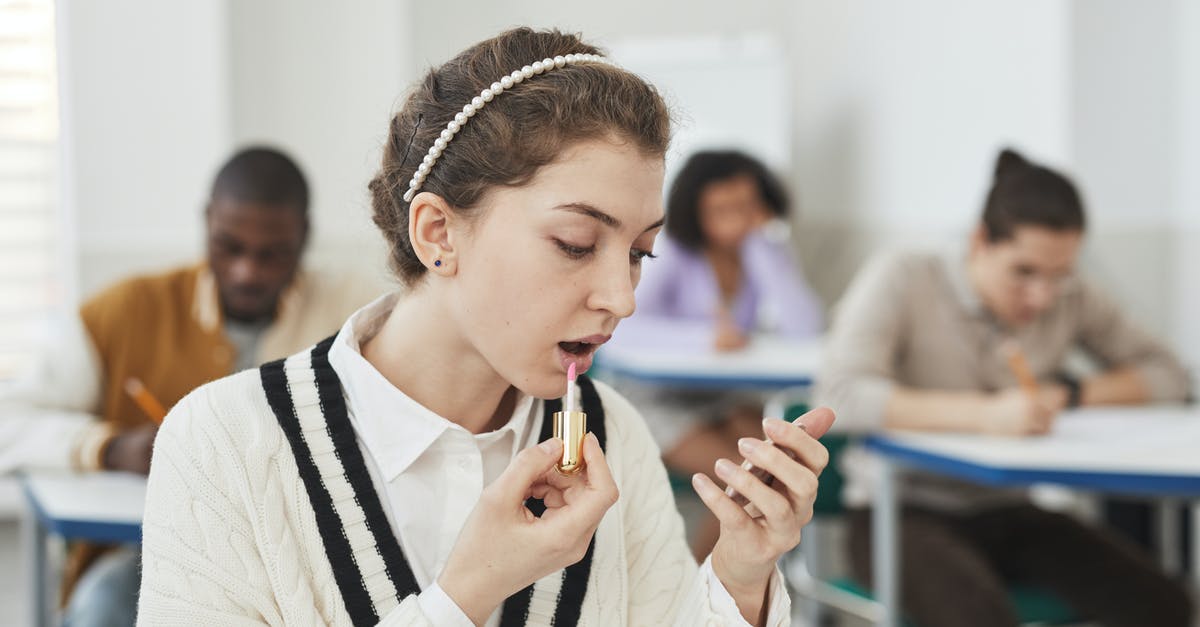 Applying for a visa for Pakistan as a student in Australia - A Woman Applying Lipstick in a Classroom Applying for a visa for Pakistan as a student in Australia - A Woman Applying Lipstick in a Classroom