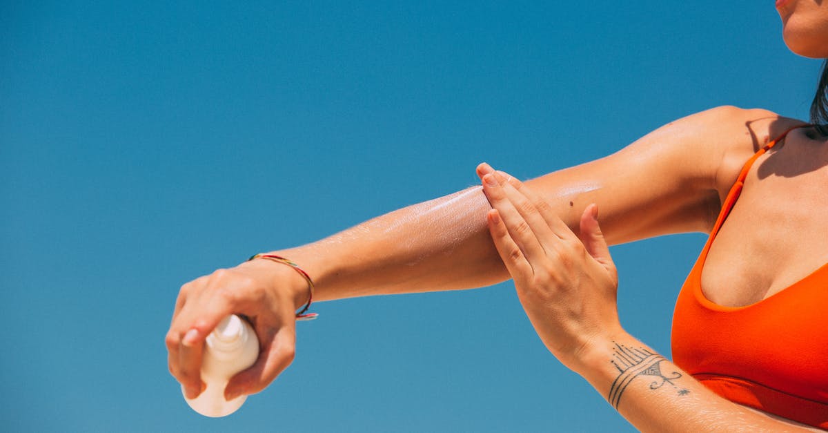 Applying for an Ireland visa after refusal by the UK [closed] - A Woman Applying Sunscreen on Arm