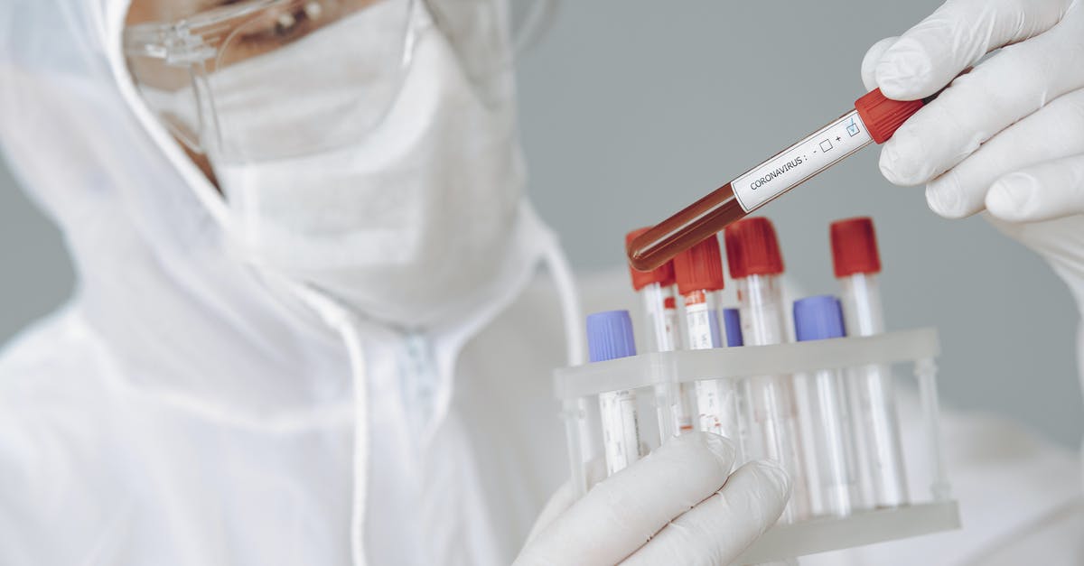 Applying for the Short-Term Study visa UK but there is problem [closed] - Crop scientist holding test tube with positive coronavirus result