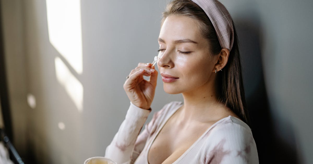 Applying for UK VISA - TLS UKVI MUP PRODUCT [duplicate] - Photo of a Woman Applying Cream on Her Face