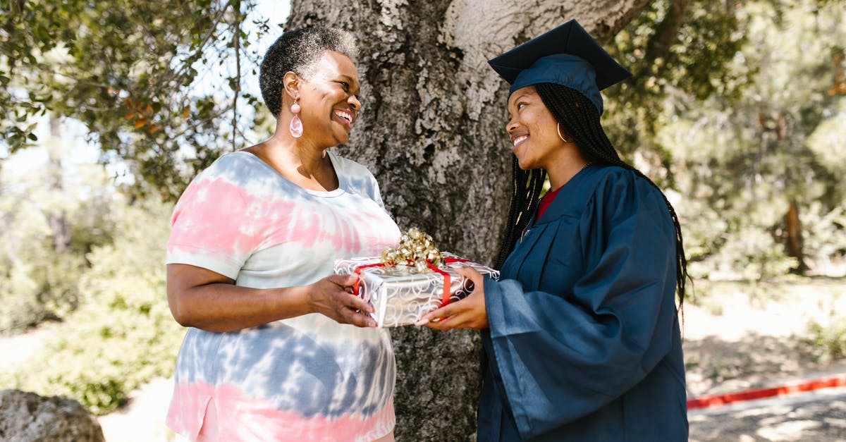 Applying for UK Visitor visa for daughter's graduation - A Woman Giving a Graduation Gift to her Daughter Applying for UK Visitor visa for daughter's graduation - A Woman Giving a Graduation Gift to her Daughter