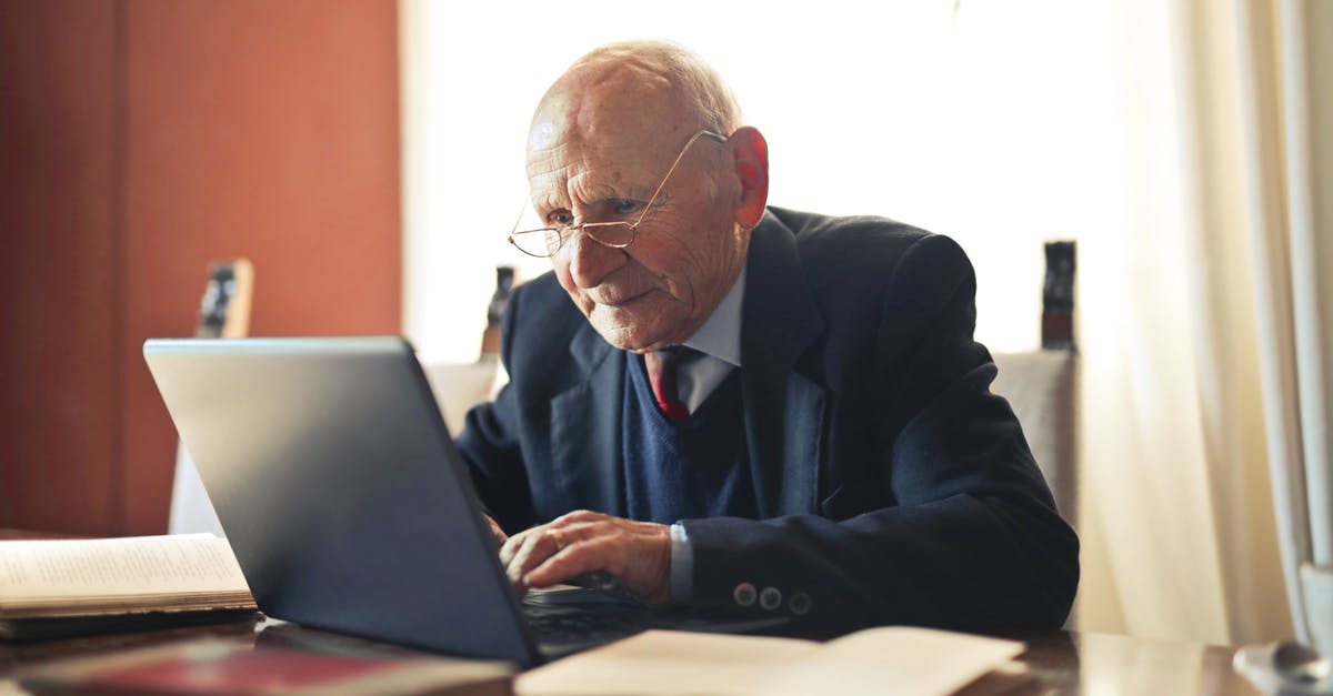 Applying (Reclaiming) French Schengen Visa without My Old Passports and Information about my Old Visa - Concentrate elderly senior man in formal suit and eyeglasses working on laptop while sitting at wooden table with books in light room Applying (Reclaiming) French Schengen Visa without My Old Passports and Information about my Old Visa - Concentrate elderly senior man in formal suit and eyeglasses working on laptop while sitting at wooden table with books in light room