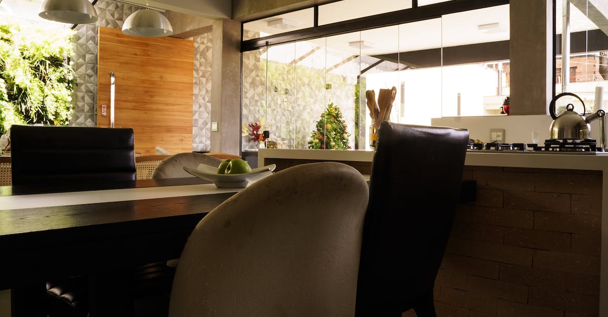 Approximately how much for housing and food in Seoul, Korea? - Plate with green apples placed on table in spacious kitchen with minimalist furniture in residential house