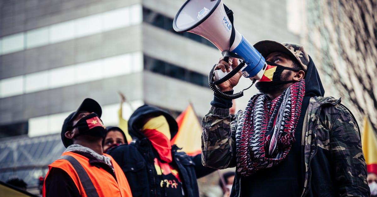 Are airlines discounting to boost demand during pandemic? - Black protesters in medical masks on street Are airlines discounting to boost demand during pandemic? - Black protesters in medical masks on street