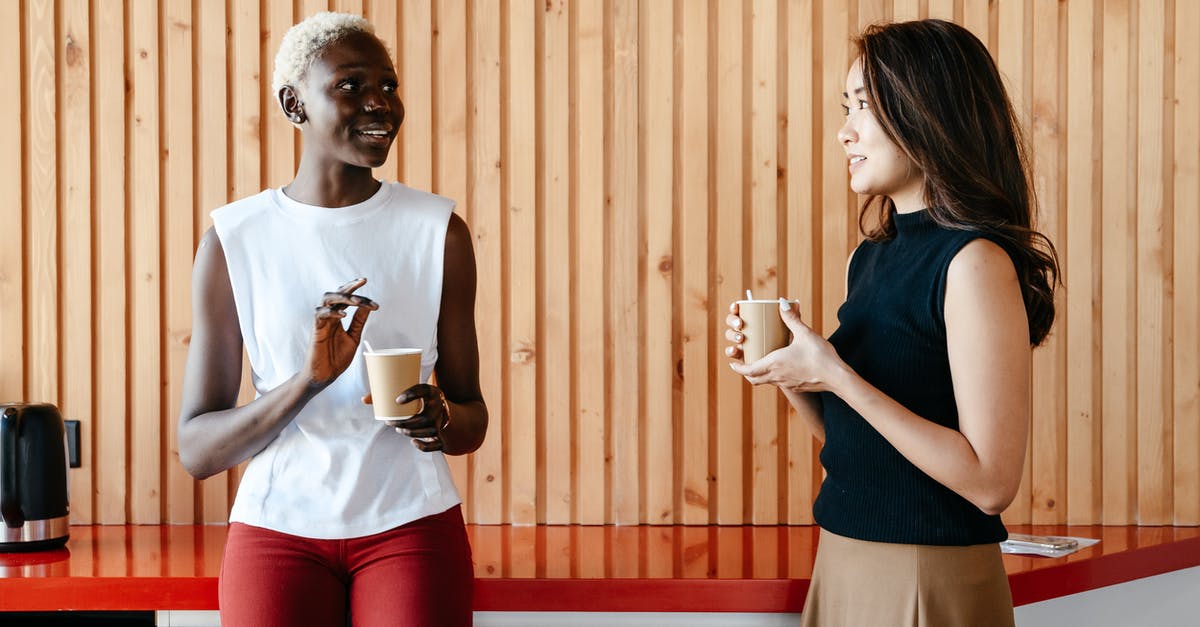 Are customs liable if they break something doing their job? - Happy multiracial women with cups of coffee smiling and discussing job in contemporary office Are customs liable if they break something doing their job? - Happy multiracial women with cups of coffee smiling and discussing job in contemporary office