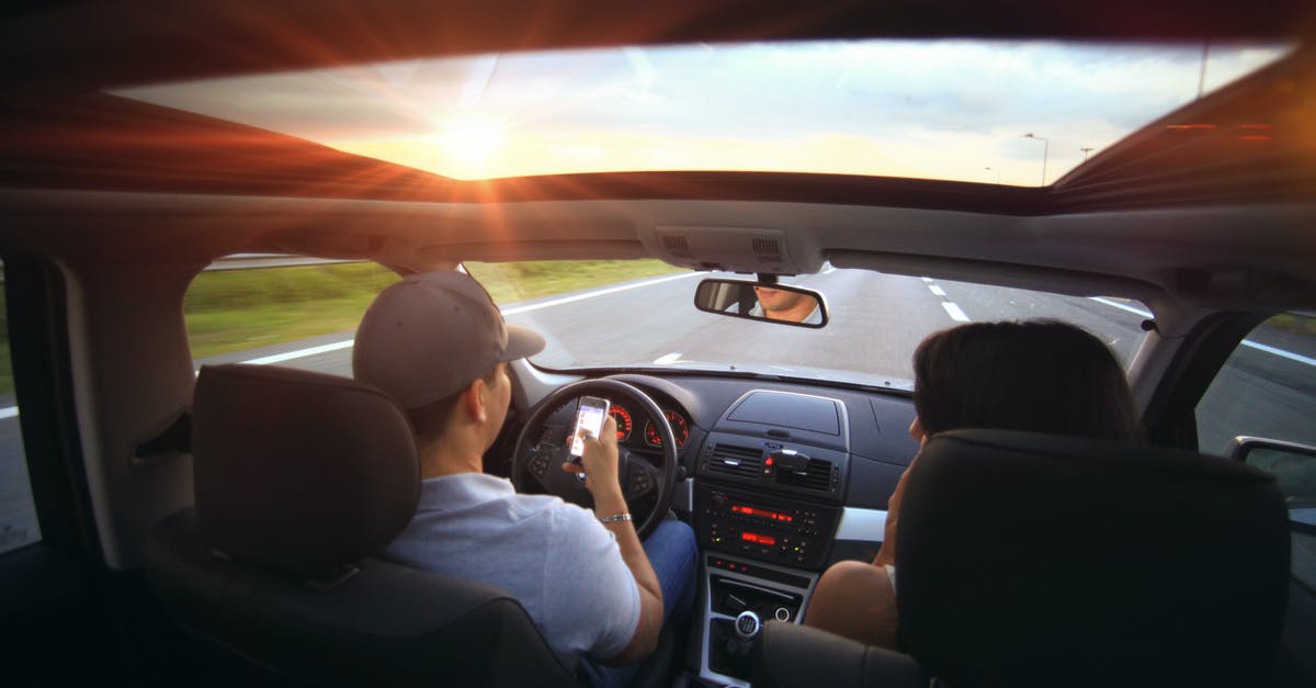 Are drivers from mainland Europe likely to end up in an accident when driving in the UK? - Man Using Smartphone While Driving Are drivers from mainland Europe likely to end up in an accident when driving in the UK? - Man Using Smartphone While Driving