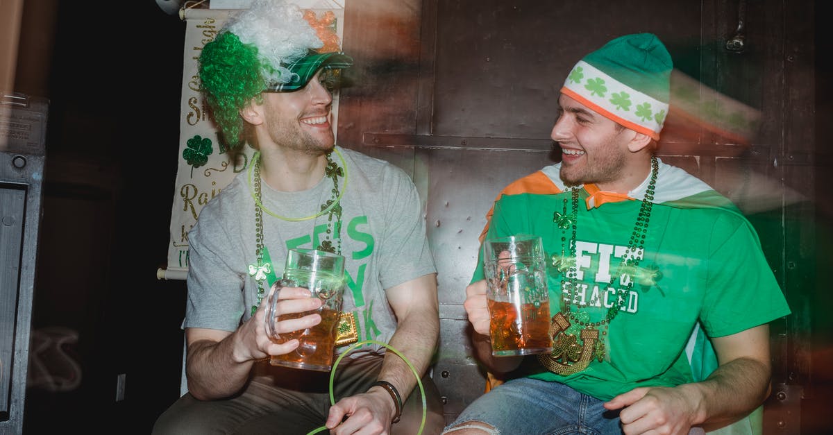 Are feathers in my hat allowed through UK & Irish customs? - Through glass wall view of smiling male partners with mugs of beer looking at each other during Feast of Saint Patrick Are feathers in my hat allowed through UK & Irish customs? - Through glass wall view of smiling male partners with mugs of beer looking at each other during Feast of Saint Patrick