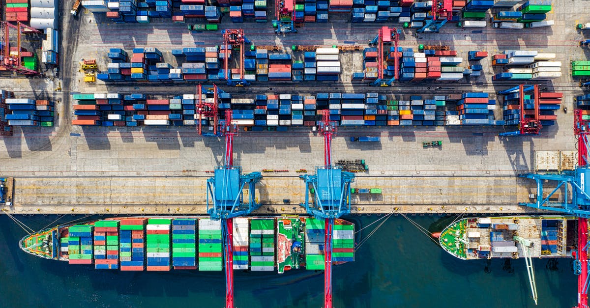 Are import duties supposed to be paid within the airport customs area itself? - Birds-eye View Photo of Freight Containers Are import duties supposed to be paid within the airport customs area itself? - Birds-eye View Photo of Freight Containers