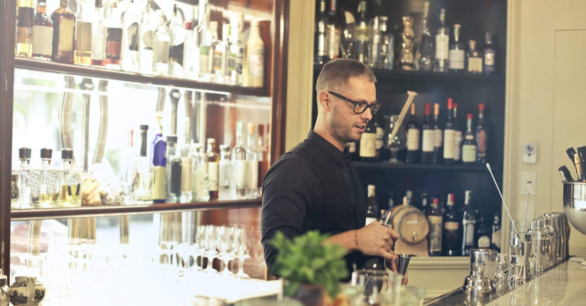 Are izakaya where the bartender doesn't stand opposite the bar inauthentic? - Man in Black Top Standing in Front of Bar Counter Are izakaya where the bartender doesn't stand opposite the bar inauthentic? - Man in Black Top Standing in Front of Bar Counter