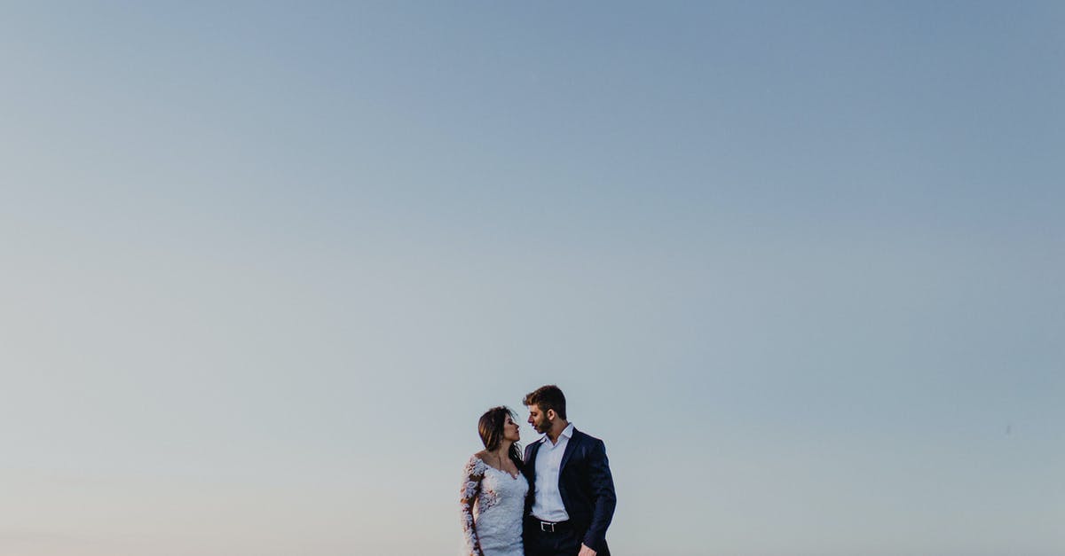 Are laws about sex outside marriage less rigorously enforced in Dubai for people on layovers? - Photo Of Couple Standing Near Each Other
