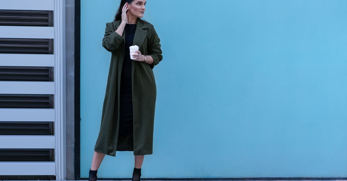 Are laws about sex outside marriage less rigorously enforced in Dubai for people on layovers? - Photo Of Woman Wearing Green Coat