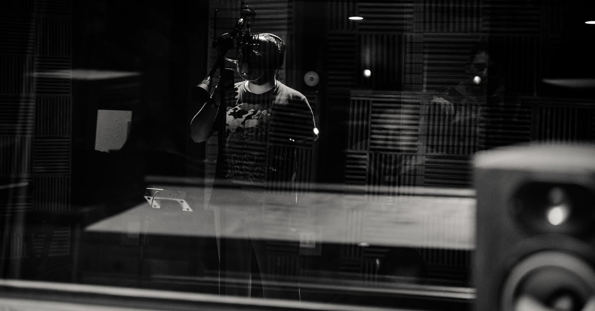 Are live leeches allowed through TSA checkpoints? - Through glass of black and white anonymous male musician in headphones singing with microphone while recording song in modern studio Are live leeches allowed through TSA checkpoints? - Through glass of black and white anonymous male musician in headphones singing with microphone while recording song in modern studio