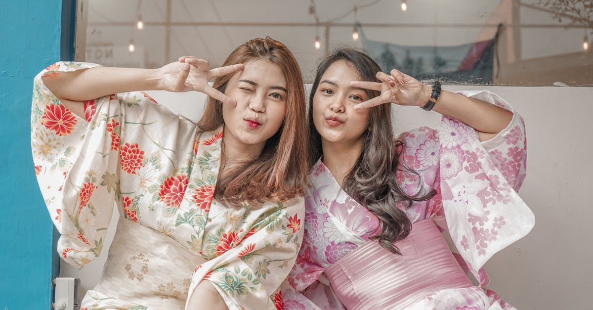 Are most flights to Japan staffed by hosts with good Japanese? - Woman in White and Red Floral Dress Lying on Bed Are most flights to Japan staffed by hosts with good Japanese? - Woman in White and Red Floral Dress Lying on Bed