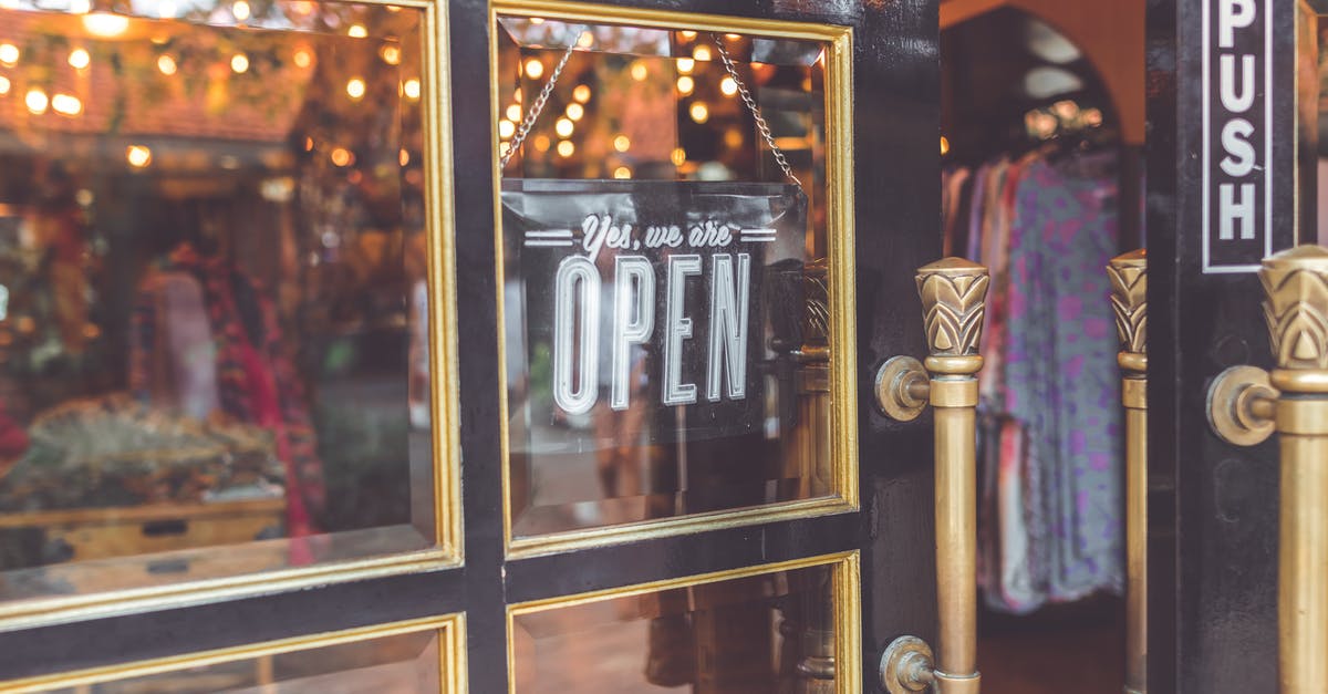 Are Parisian shops open on Sundays? - Closeup Photo Black Door Yes We Are Open Signage Are Parisian shops open on Sundays? - Closeup Photo Black Door Yes We Are Open Signage