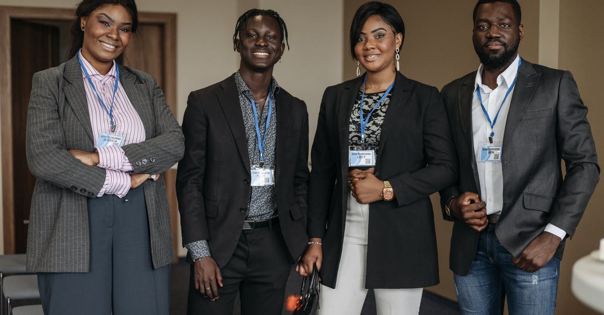 Are "TAXI" badge wearing people at the exit of FCO legal? - Group of People Wearing Corporate Attire and Badge Smiling Are "TAXI" badge wearing people at the exit of FCO legal? - Group of People Wearing Corporate Attire and Badge Smiling