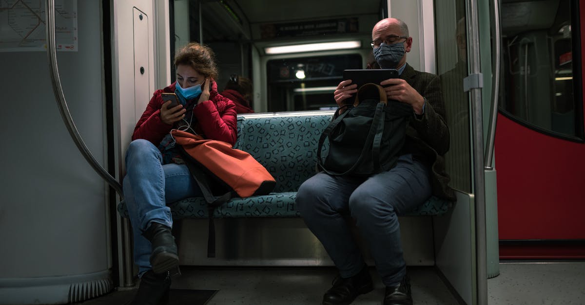 Are seat reservations still valid on delayed / overcrowded trains? - Man in Black Jacket Sitting Beside Woman in Red Jacket Are seat reservations still valid on delayed / overcrowded trains? - Man in Black Jacket Sitting Beside Woman in Red Jacket