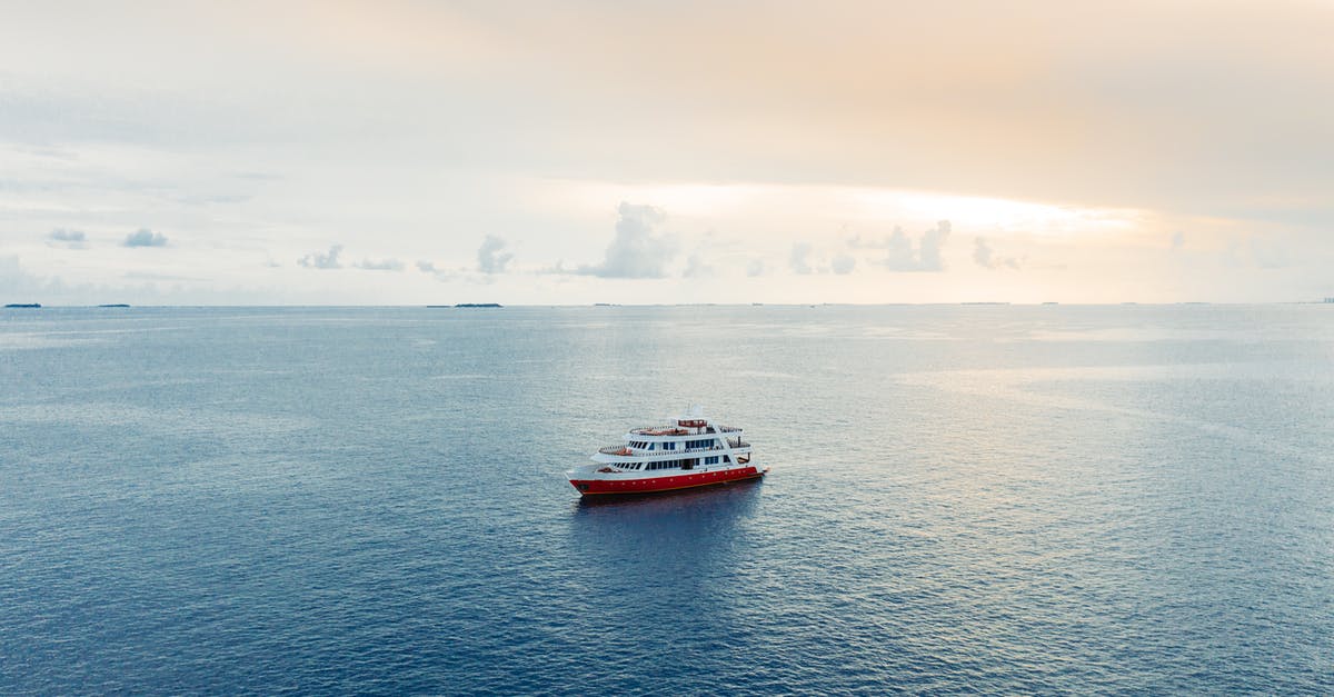 Are the Canadian Journey Series banknotes still accepted in shops in Canada? - Picturesque view of cruise ship floating on blue rippling seawater under light pink sky at twilight