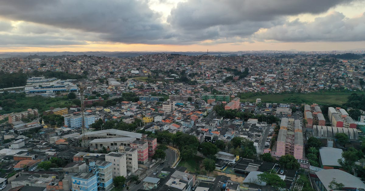 Are there air traffic routes that are turbulence-sensitive? - Cityscape of modern green district at sundown Are there air traffic routes that are turbulence-sensitive? - Cityscape of modern green district at sundown