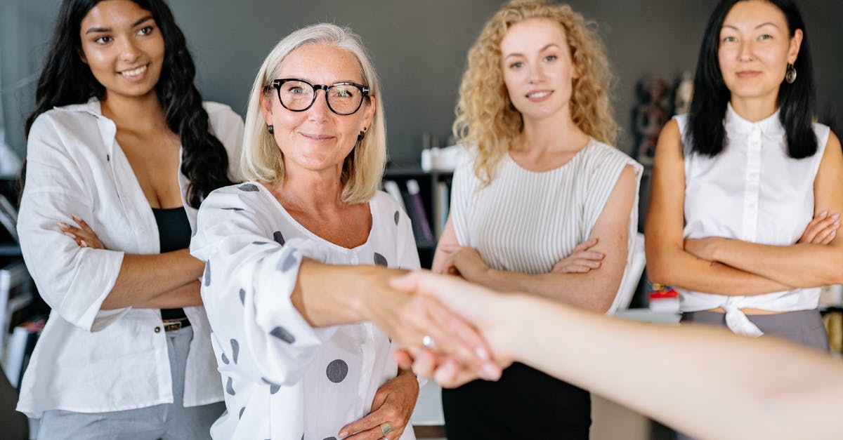 Are there any alternatives to the handshake worldwide? - Woman in White Sleeveless Shirt Wearing Eyeglasses Are there any alternatives to the handshake worldwide? - Woman in White Sleeveless Shirt Wearing Eyeglasses