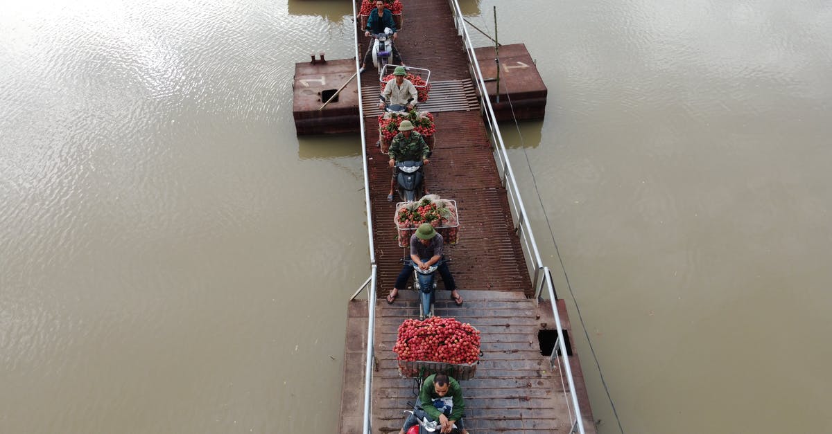 Are there any countries in South-East Asia that don't require a motorcycle licence to ride one? - From above of people transporting food in baskets on motorbikes riding on float bridge above rippled river Are there any countries in South-East Asia that don't require a motorcycle licence to ride one? - From above of people transporting food in baskets on motorbikes riding on float bridge above rippled river