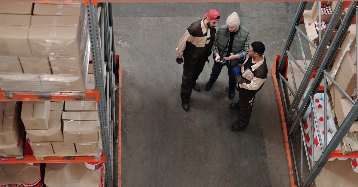 Are there any data on the incidence of theft in airports' airside areas? - Men Standing in a Warehouse Talking Are there any data on the incidence of theft in airports' airside areas? - Men Standing in a Warehouse Talking