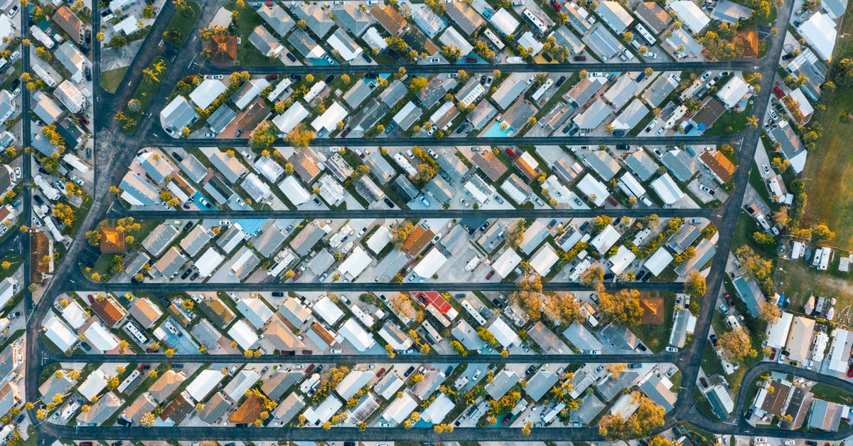 Are there any hostels or similar accommodation in the highlands along route 175 from Oaxaca City to Pochutla? - Drone view of modern buildings located in rows between roads in suburb of contemporary town on daytime Are there any hostels or similar accommodation in the highlands along route 175 from Oaxaca City to Pochutla? - Drone view of modern buildings located in rows between roads in suburb of contemporary town on daytime