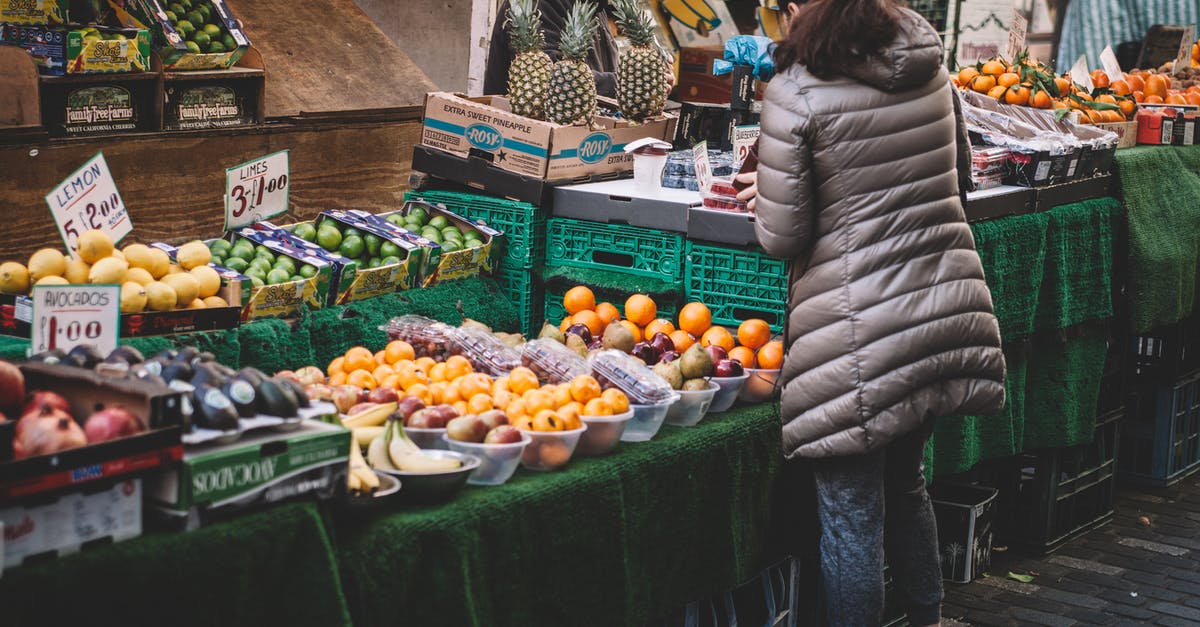 Are there any local shops to buy/eat shortbread in Edinburgh? [closed] - Woman Standing in Front of Assorted Fruits Displayed