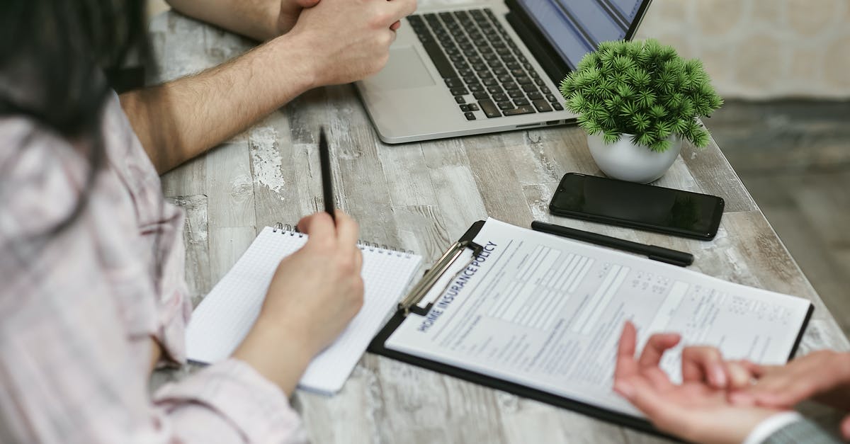 Are there any non-obvious differentiators in travel-insurance policies? - A Couple Talking to an Insurance Agent Are there any non-obvious differentiators in travel-insurance policies? - A Couple Talking to an Insurance Agent