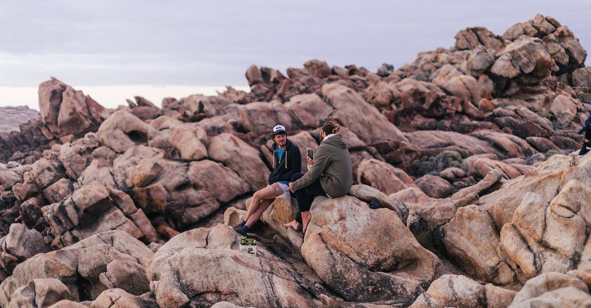 Are there any perks/discounts for travelling as a couple on Air France? - Unrecognizable couple of tourists resting on rocks Are there any perks/discounts for travelling as a couple on Air France? - Unrecognizable couple of tourists resting on rocks