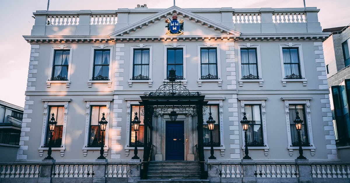 Are there any RED flags raised when we call UK Home Office for settlement visa status update? [closed] - White Two-story Concrete Building Under Blue Sky