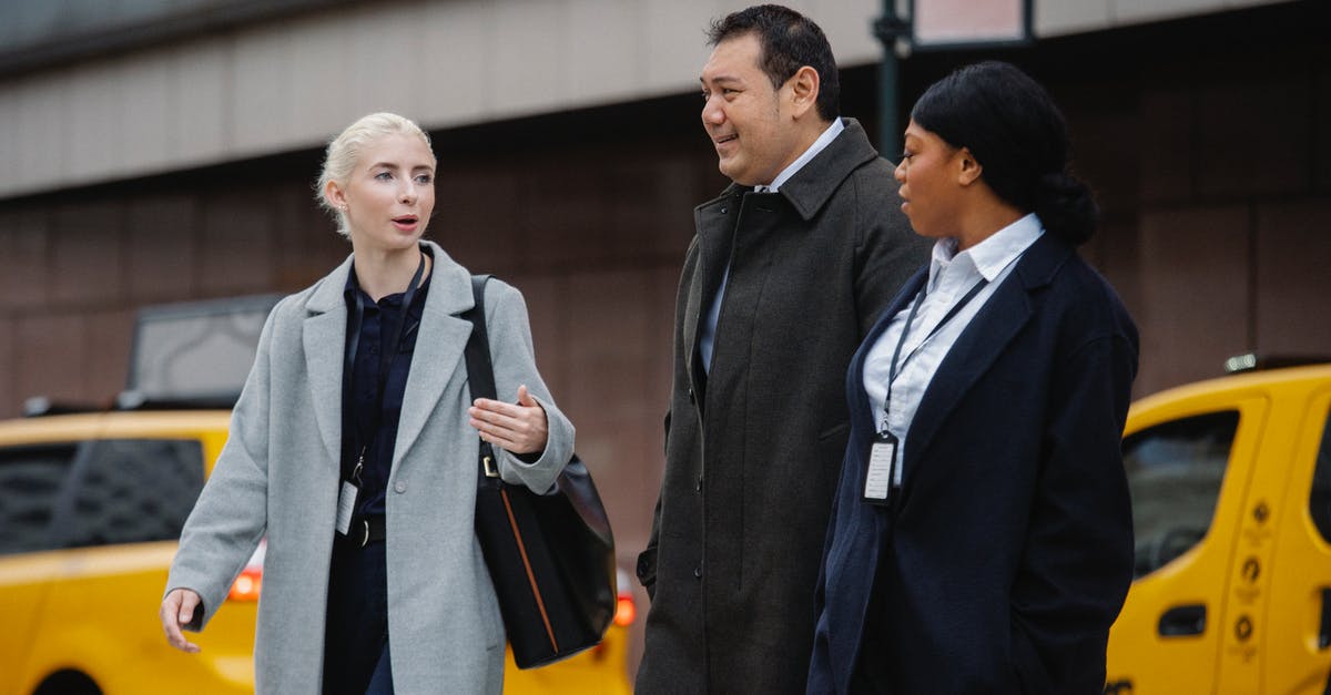 Are there any roads you can't walk as a pedestrian on in New Zealand? - Positive multiracial coworkers in formal clothes walking together on street and discussing news on autumn day Are there any roads you can't walk as a pedestrian on in New Zealand? - Positive multiracial coworkers in formal clothes walking together on street and discussing news on autumn day