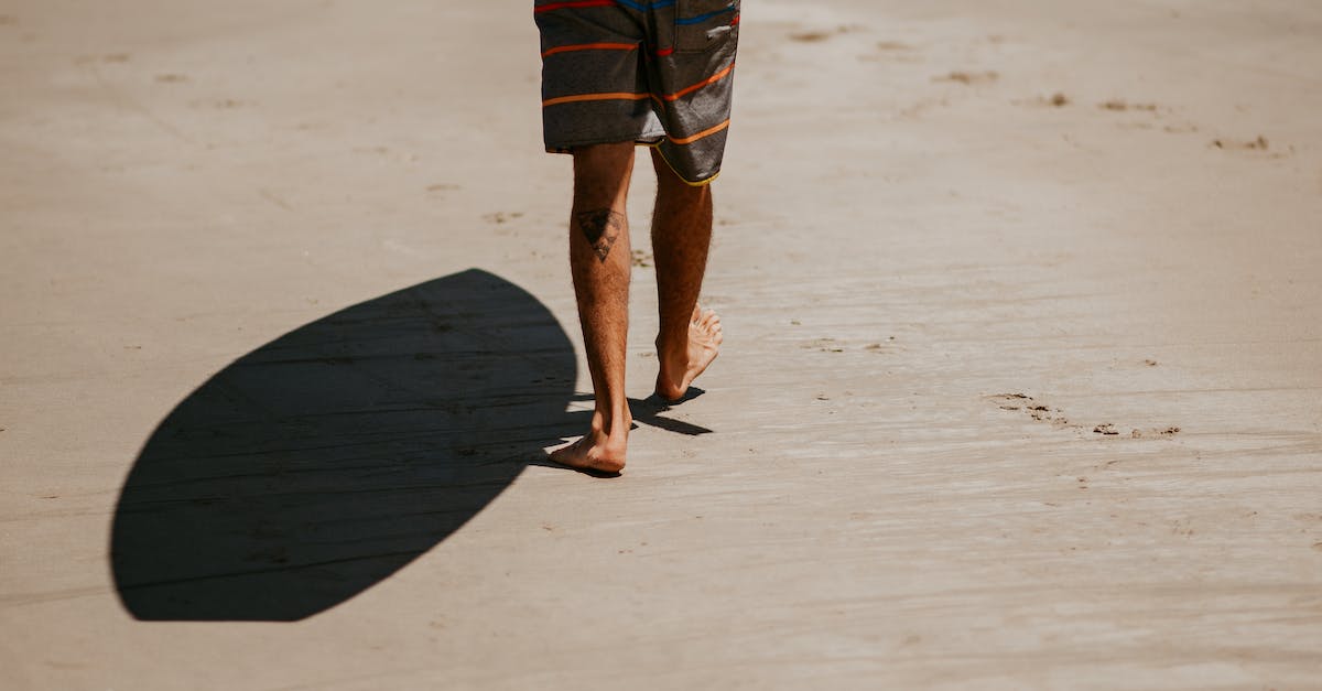 Are there any specific documents to carry when travelling from Bangalore to Hong Kong via Bangkok without visa? - Barefoot man with surfboard walking on sandy beach Are there any specific documents to carry when travelling from Bangalore to Hong Kong via Bangkok without visa? - Barefoot man with surfboard walking on sandy beach