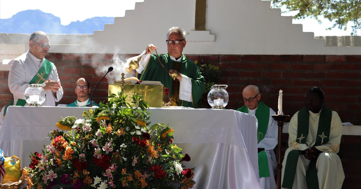 Are there any Taizé worship services in Bergen? - Elderly priest in eyewear and catholic vestment standing with censer near table with Bible and diverse deacons during mass process near colorful bouquet in sunlight in back lit Are there any Taizé worship services in Bergen? - Elderly priest in eyewear and catholic vestment standing with censer near table with Bible and diverse deacons during mass process near colorful bouquet in sunlight in back lit