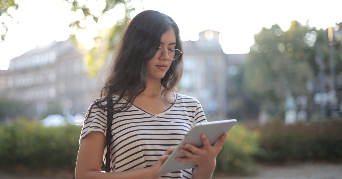 Are there any tool/sites I can use to plan my route? - Calm pensive female freelancer using digital tablet on street Are there any tool/sites I can use to plan my route? - Calm pensive female freelancer using digital tablet on street