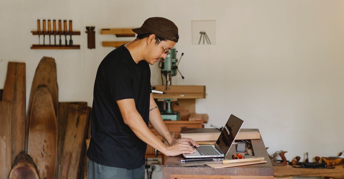 Are there any tool/sites I can use to plan my route? - Concentrated ethnic guy browsing laptop in woodworker workshop Are there any tool/sites I can use to plan my route? - Concentrated ethnic guy browsing laptop in woodworker workshop