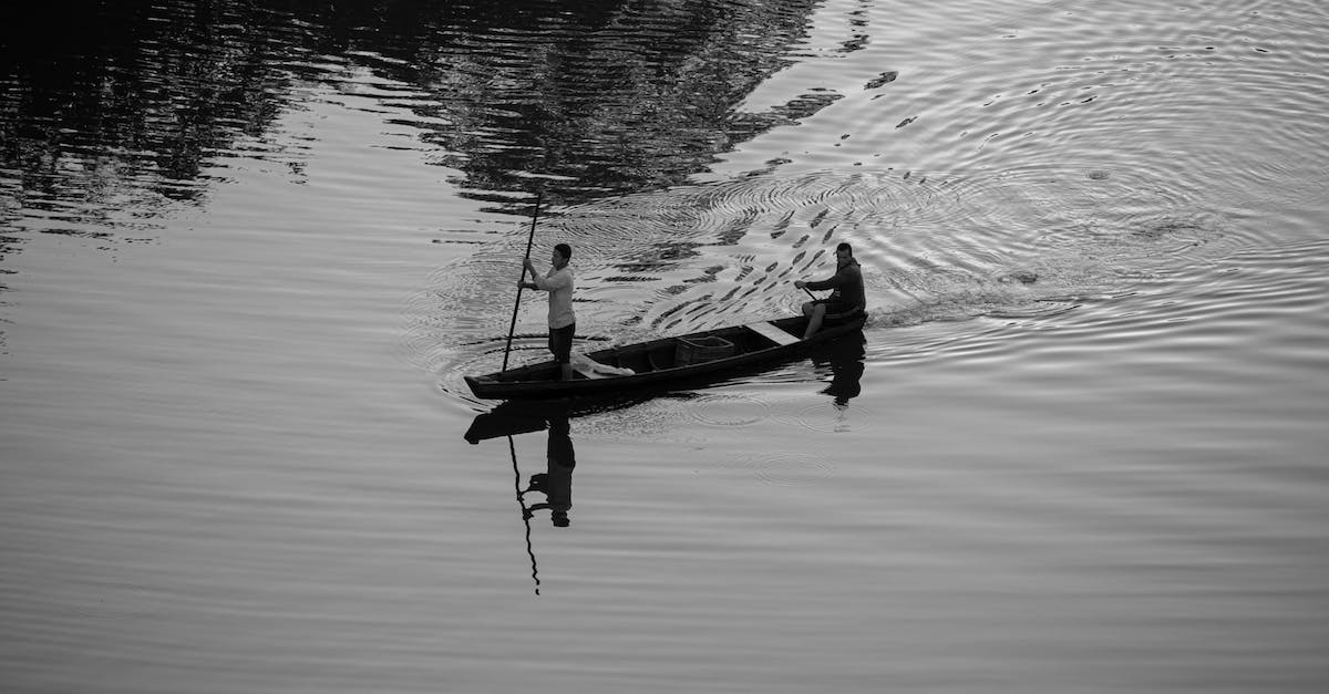 Are there any traditional German Christmas markets in the Lake District, UK? - Man Riding on Boat on Water Are there any traditional German Christmas markets in the Lake District, UK? - Man Riding on Boat on Water