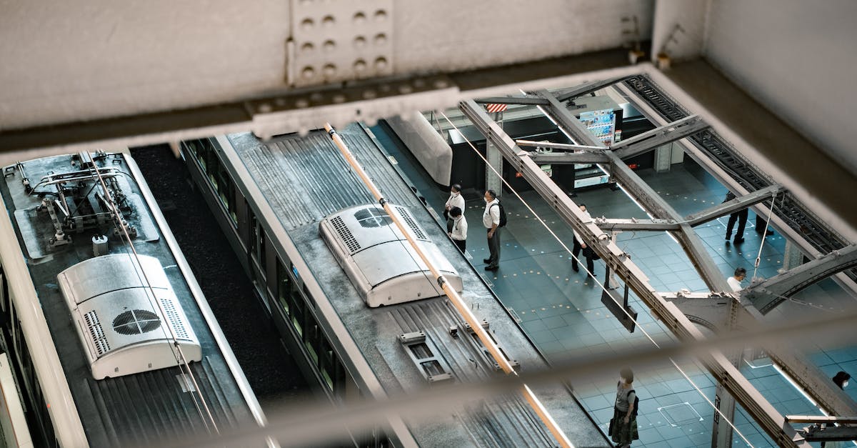 Are there any trains where roof riding is legally possible? - High Angle Shot of People Standing on Train Station Platform Are there any trains where roof riding is legally possible? - High Angle Shot of People Standing on Train Station Platform