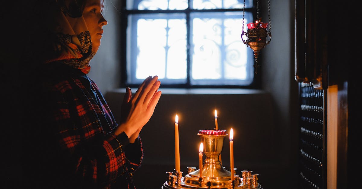 Are there any women-only places in the world? - Woman in Black and White Plaid Dress Shirt Holding Lighted Candles Are there any women-only places in the world? - Woman in Black and White Plaid Dress Shirt Holding Lighted Candles