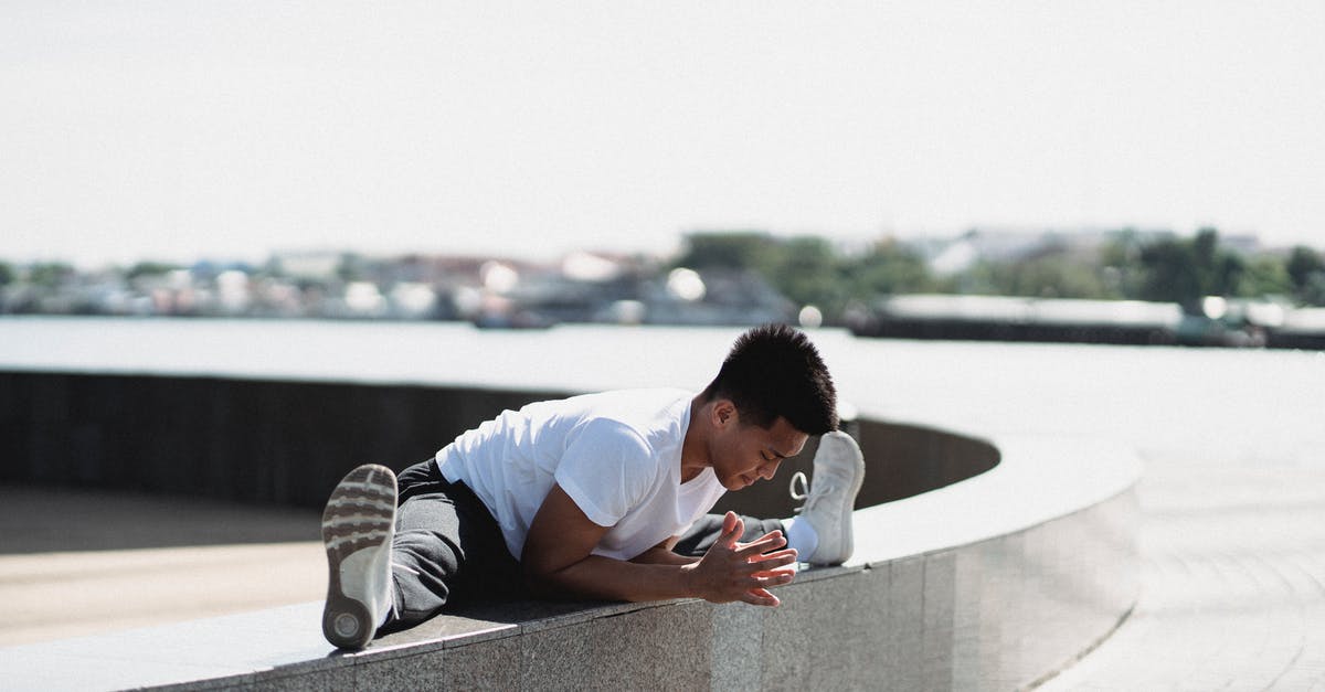 Are there border checks on the Kosovo-Serbia (Mitrovica-Kraljevo) train? - Full body sporty young Asian male in activewear doing split and bending body towards while warming up on embankment border on sunny weather Are there border checks on the Kosovo-Serbia (Mitrovica-Kraljevo) train? - Full body sporty young Asian male in activewear doing split and bending body towards while warming up on embankment border on sunny weather