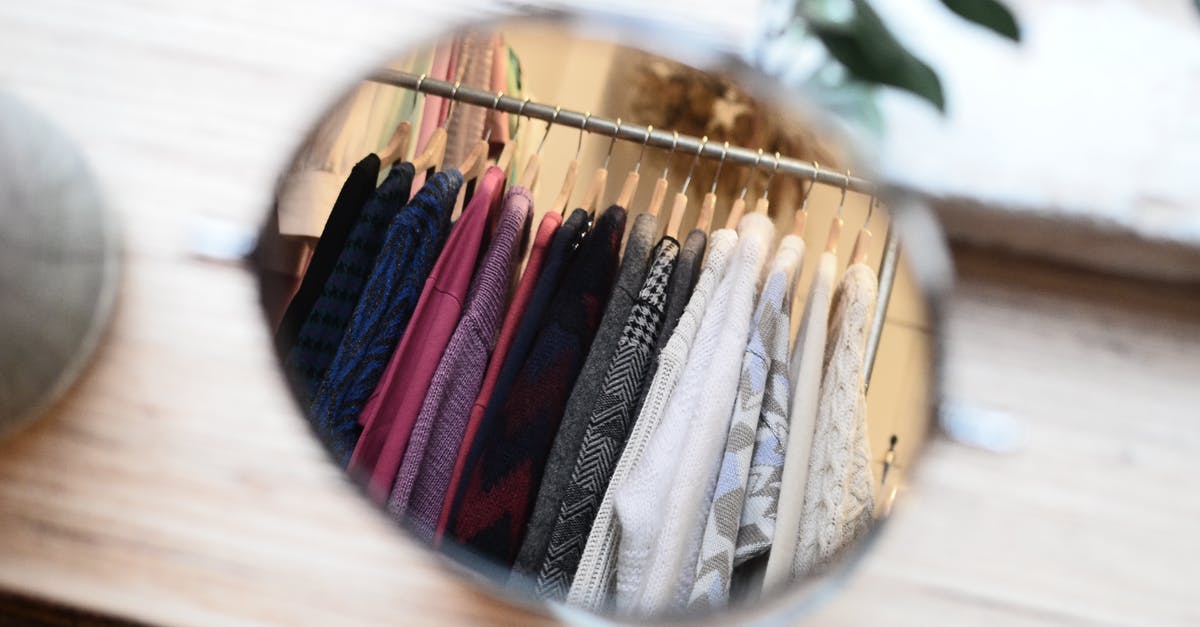 Are there differences between Japan Rail pass vendors? - Clothes hanging on rack in reflection of mirror