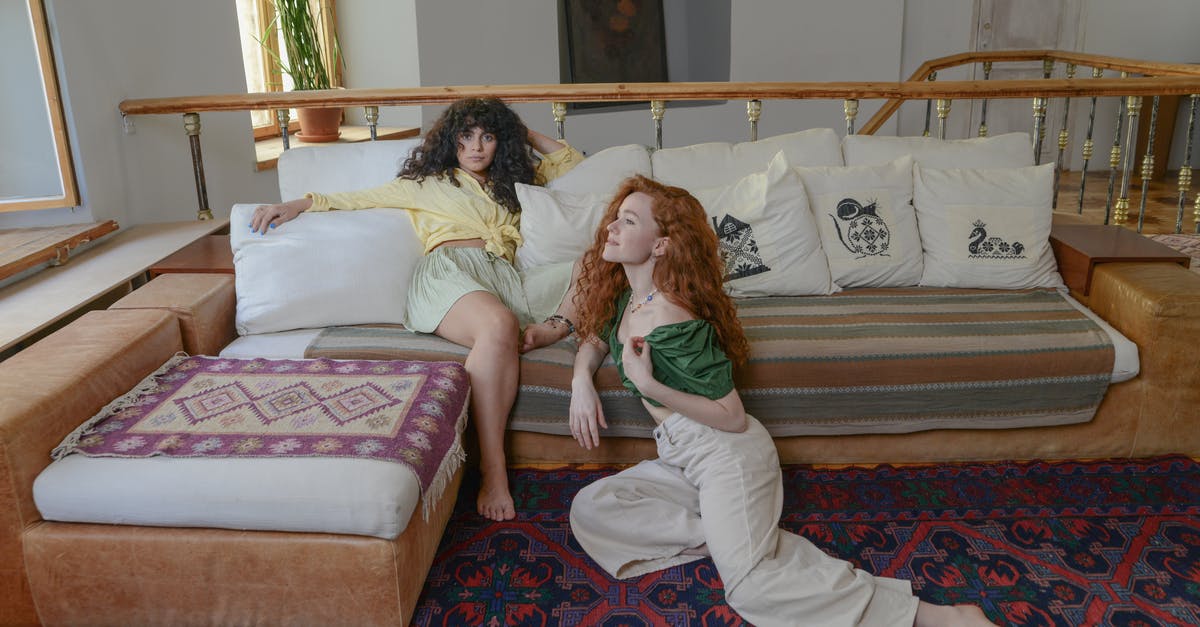 Are there interior guided tours of the Seven Sisters? - Ginger Woman Sitting on the Carpet Beside Woman on Couch Are there interior guided tours of the Seven Sisters? - Ginger Woman Sitting on the Carpet Beside Woman on Couch