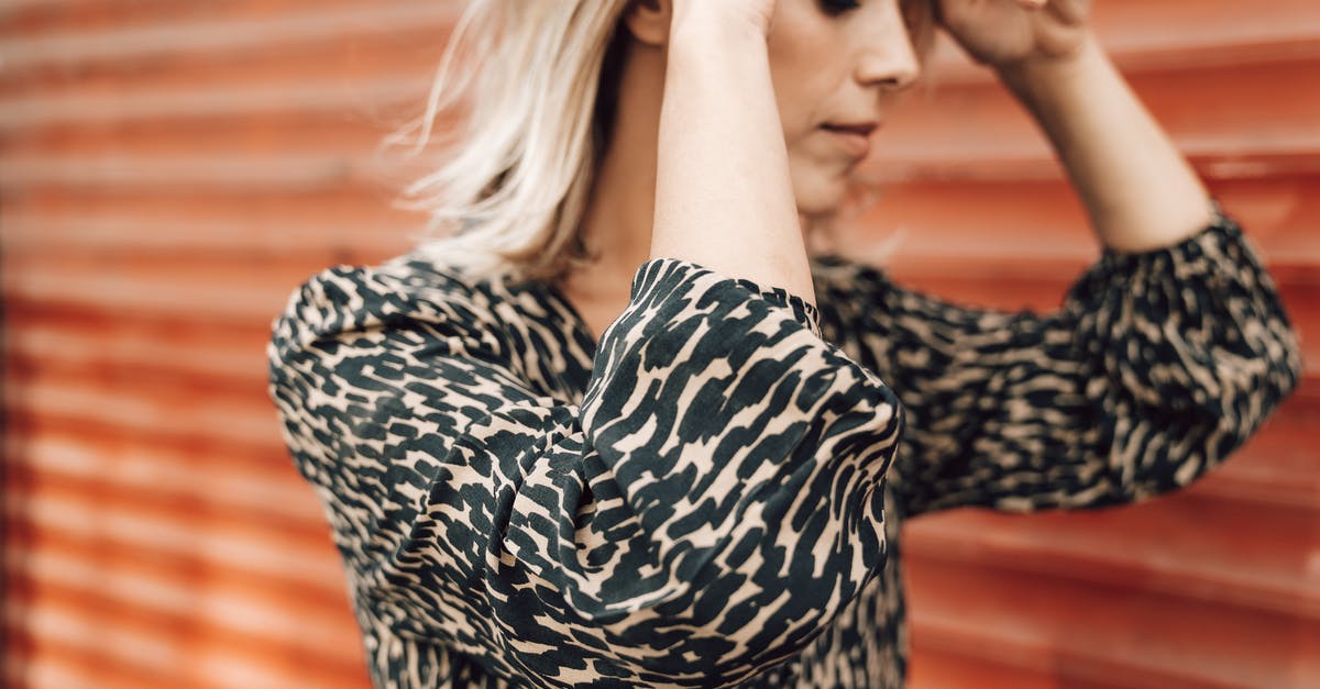 Are there long-term lockers near Istanbul's Sabiha Gökçen airport? - Charming woman adjusting hair on street Are there long-term lockers near Istanbul's Sabiha Gökçen airport? - Charming woman adjusting hair on street