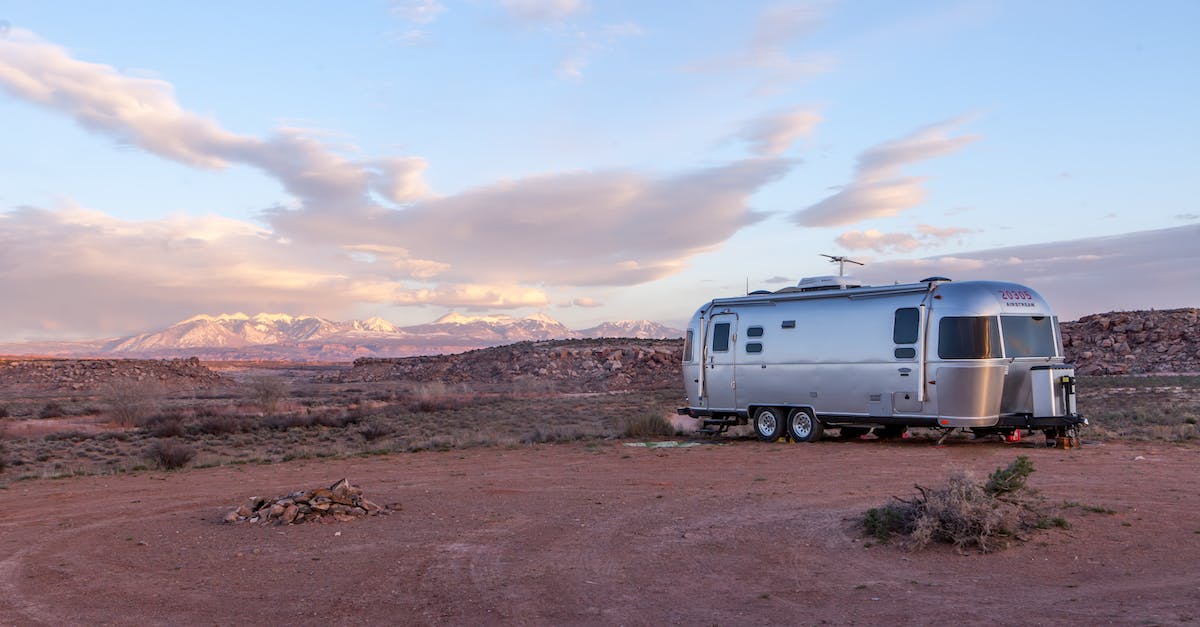 Are there open air hot springs in natural settings in the mountains of Georgia (the country)? - Grey and Black Recreational Vehicle on Ground Under Blue and White Sky Are there open air hot springs in natural settings in the mountains of Georgia (the country)? - Grey and Black Recreational Vehicle on Ground Under Blue and White Sky
