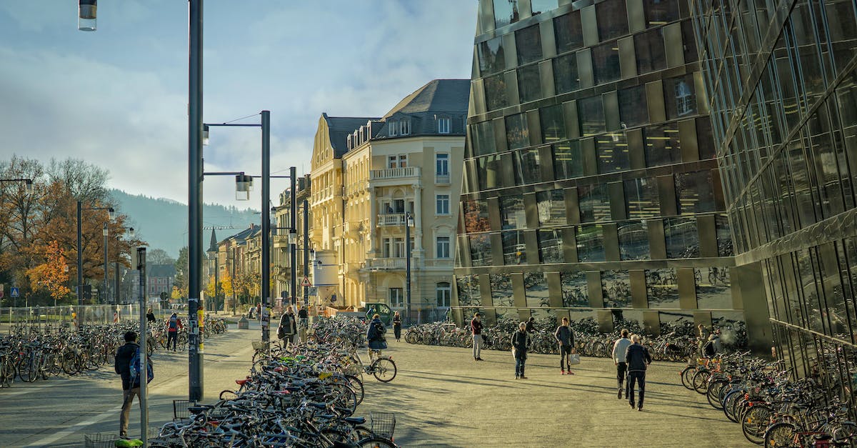 Are there really walking groups in malls in the US? - Group of People Walking on Street Near Bicycle and Highrise Building Are there really walking groups in malls in the US? - Group of People Walking on Street Near Bicycle and Highrise Building