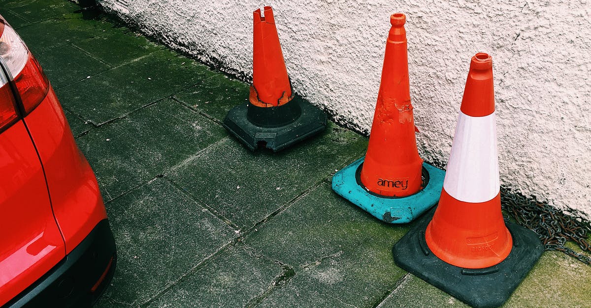 Are there red light districts in St. Petersburg or Moscow? - Traffic cones placed near car on road in city street Are there red light districts in St. Petersburg or Moscow? - Traffic cones placed near car on road in city street