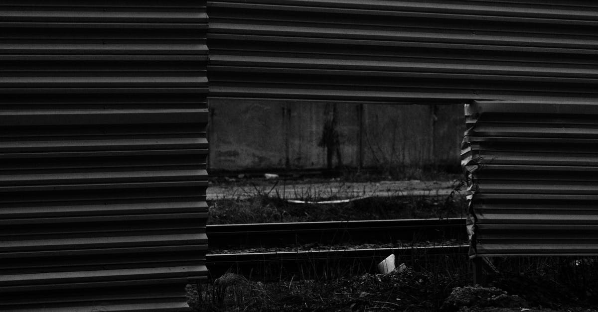 Are there Schengen airports besides Budapest with border "holes"? - Black and white of automobile road and rails visible through square hole in lower part of enclosure from metallic profile Are there Schengen airports besides Budapest with border "holes"? - Black and white of automobile road and rails visible through square hole in lower part of enclosure from metallic profile
